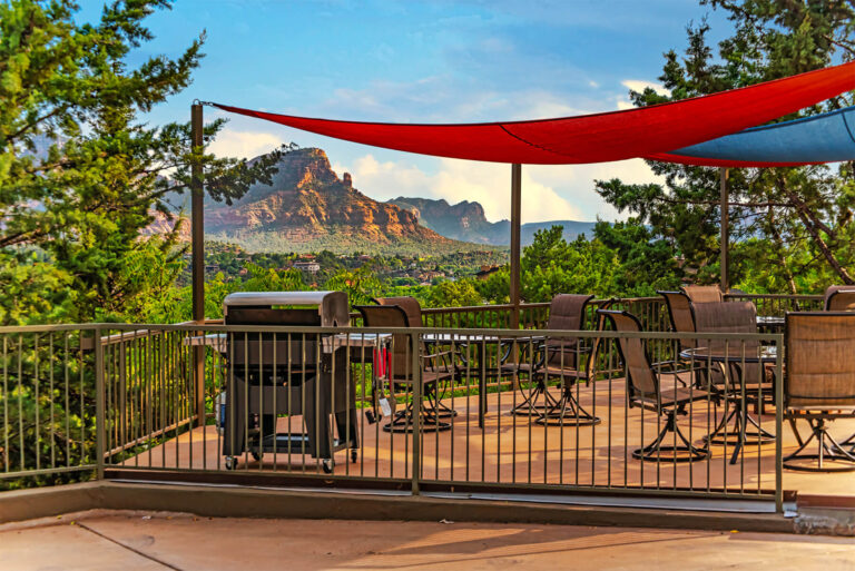 Uptown View Villas shared patio space with covered tables, grill and firepit